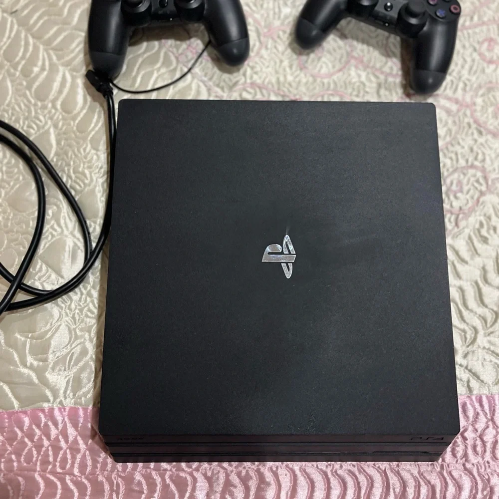 Sony PS4 Pro Console with DualShock Controllers - Black